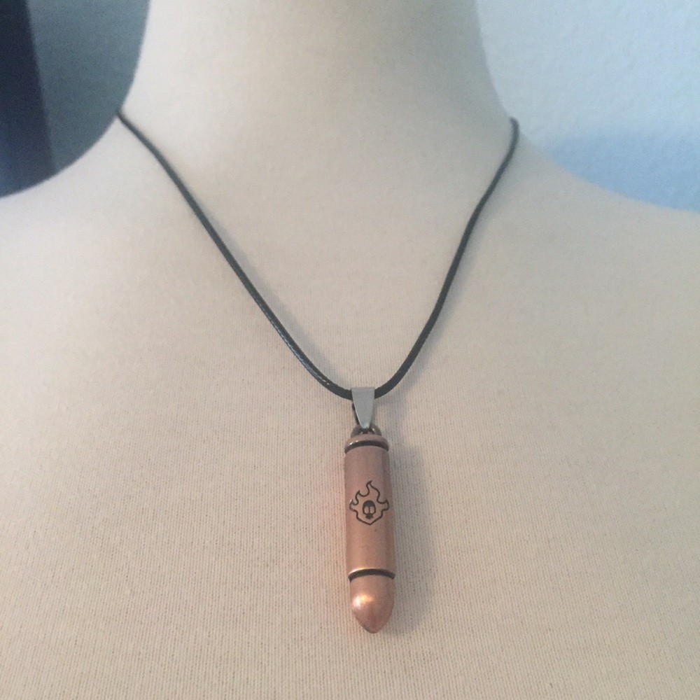 NWOT Bronze Tone Flame/Skull Bullet Necklace